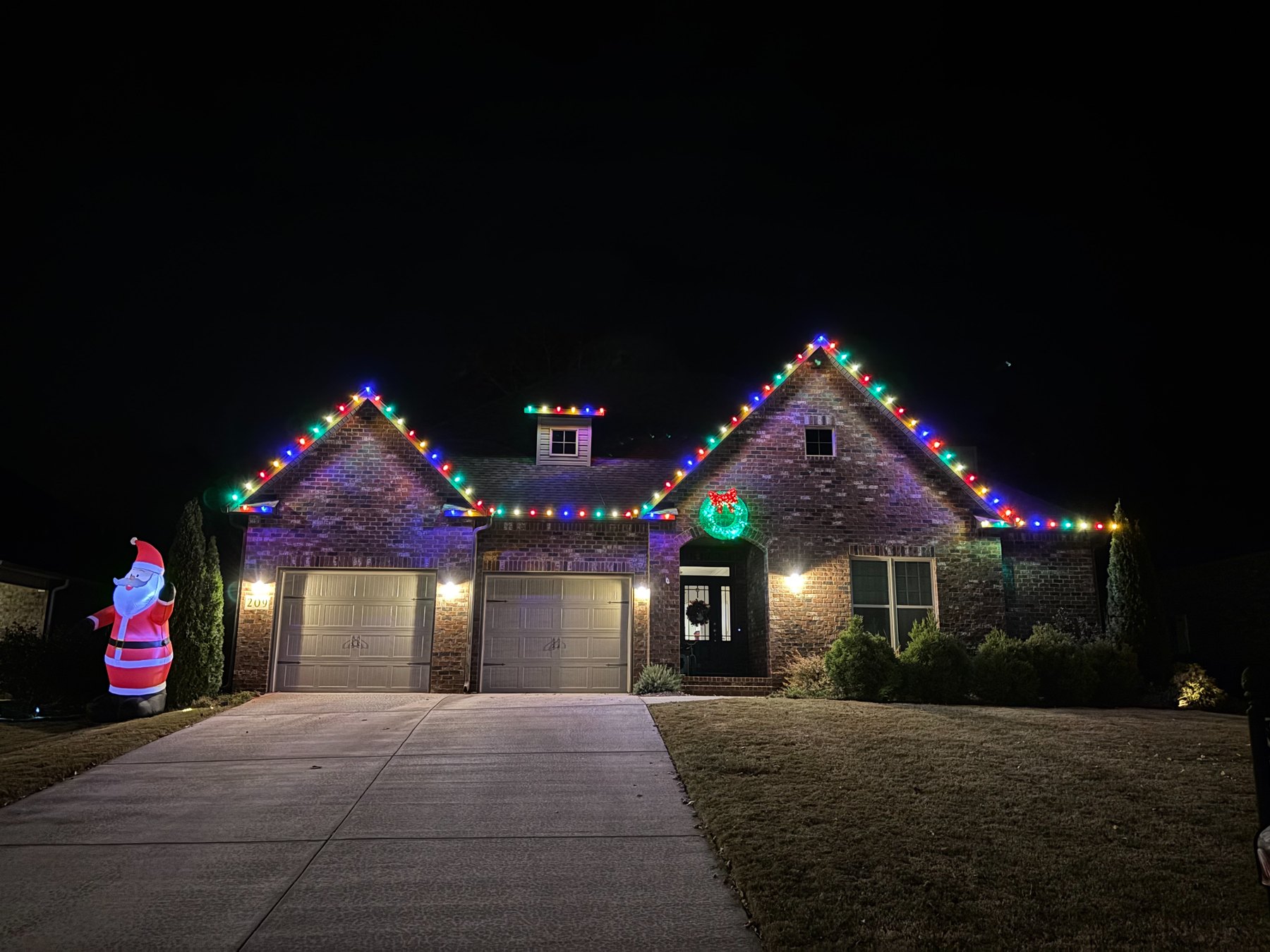 Classic multicolor Christmas lights on a residential roofline